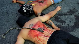 Filipino Catholics perform bloody ritual