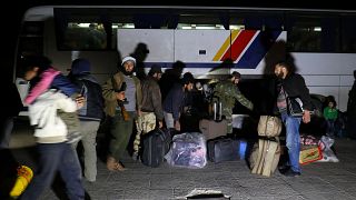 Syria evacuees arrive in shelter near Aleppo