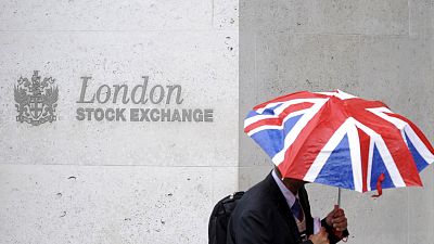 UK shares fall, pound jumps on surprise election announcement
