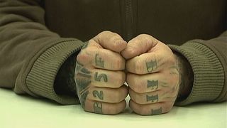 German politician loses appeal against jail term for 'Holocaust' tattoo