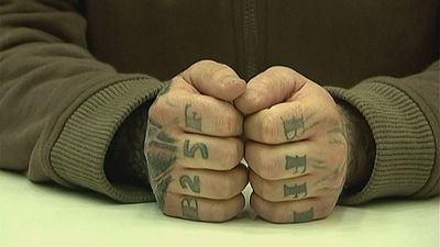 German politician loses appeal against jail term for 'Holocaust' tattoo
