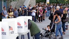 A voter marks his ballot at an early voting polling station at West Los Ang