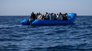 Image: An inflatable boat with 47 migrants on board is rescued by the Dutch