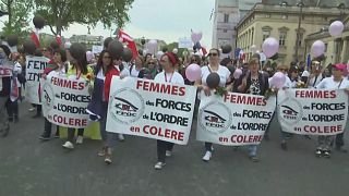 Wives march through Paris in anger over shooting of policeman