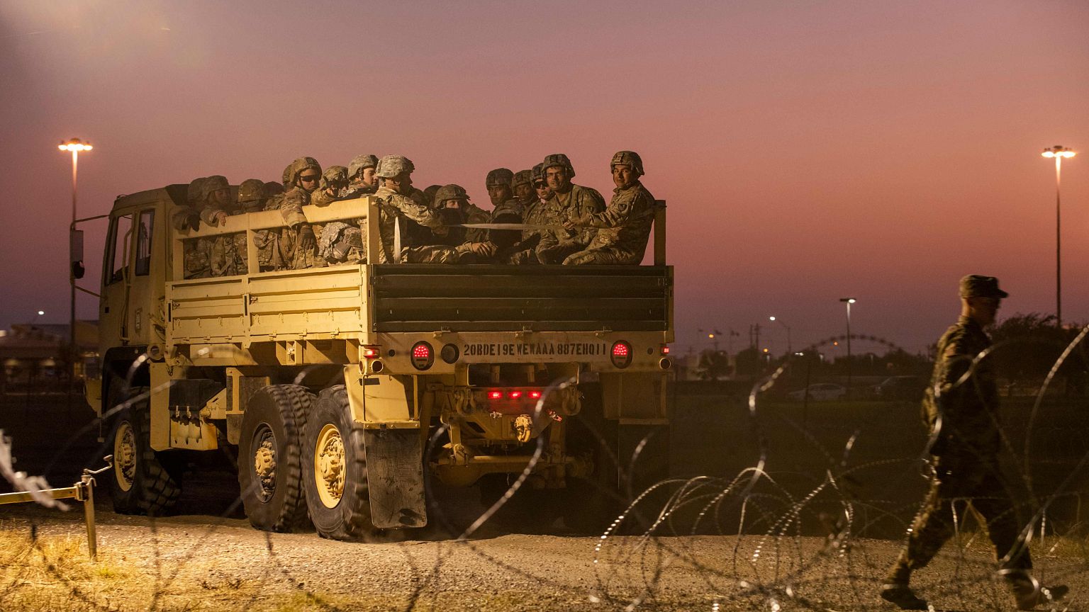 Image: Troops enter a compound near the U.S.-Mexico border crossing at Donn
