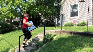 Cincinnati DoorDash worker Renee Shell delivers an order from Walmart in Ci