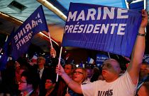 Elated Le Pen supporters brace for runoff