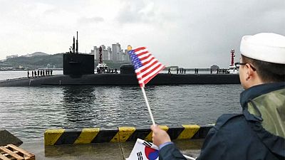 US submarine arrives in South Korea as the North carries out a huge live fire drill