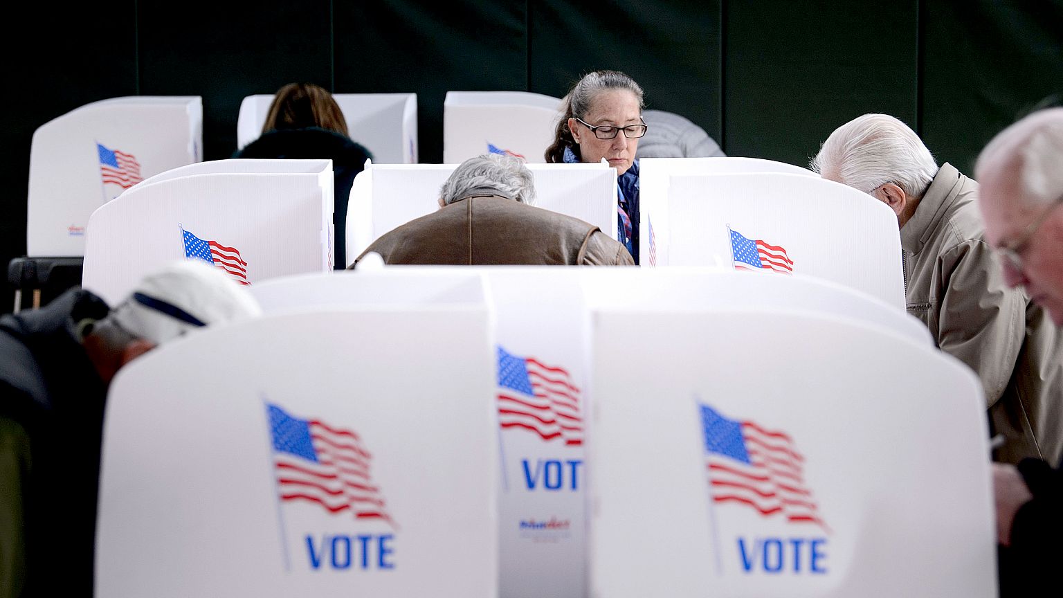 Image: People cast their ballots at a community center during early voting 