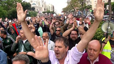 Spanish and Romanian taxi firms rally against Uber and Cabify