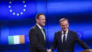 Image: Irish Prime Minister Leo Varadkar, left, shakes hands with European 