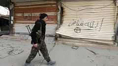 Image: A fighter from the U.S.-backed Syrian Democratic Forces in Hajin, Sy