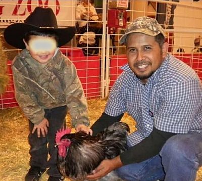 Ulises Valladares with his son, Junior. Photo blurred by source.