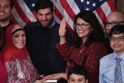 Rep. Rashida Tlaib wears a traditional Palestinian robe as she takes the the oath of office at the U.S. Capitol on Jan. 3.