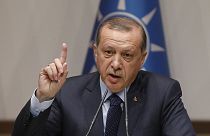 Erdogan urges EU to cooperate, or lose Turkey's membership bid