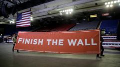 Image: Workers move a sign before a President Donald Trump rally at El Paso