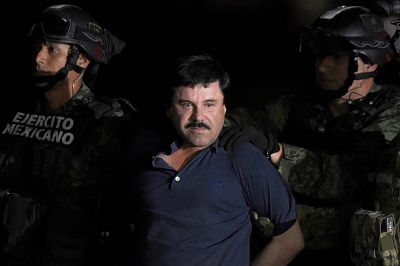 Drug kingpin Joaquin "El Chapo" Guzman is escorted into a helicopter at Mexico City\'s airport, following his recapture during an intense military operation in Los Mochis, in Sinaloa State on Jan. 8, 2016.