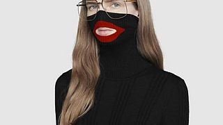Image: An online fashion outlet showing a Gucci turtleneck black wool balac