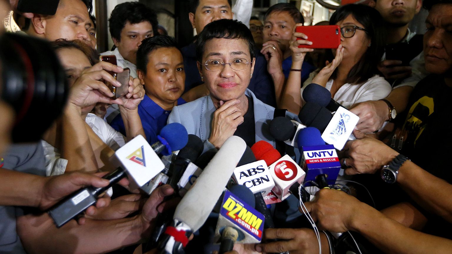 Image: Maria Ressa, center, the award-winning head of a Philippine online n