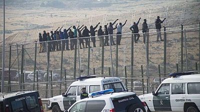 About 300 African migrants storm border fence, 100 cross into Spain
