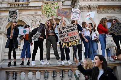 Young demonstrators hold placards as they attend a climate change protest organised by "Youth Strike 4 Climate", in central London on Feb. 15.