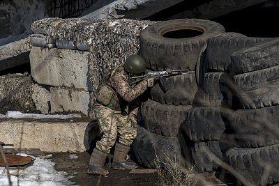 Ukrainian officer Dmitri Kebtz watches for separatist snipers.
