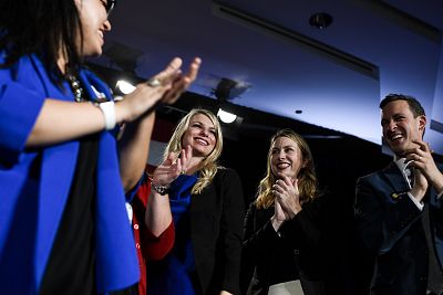 Newly elected Colorado Senator-elect Brittany Pettersen, second left, is applauded by fellow senators Julie Gonzales, left, Jessie Danielson, second right, and Steve Fenberg during the Democratic watch party in Denver on November 6, 2018.