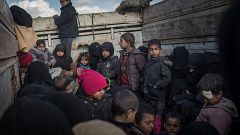 Image: Children are transported to a refugee camp after leaving Bagouz, Syr