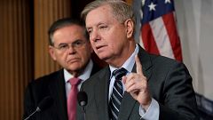 Image: Senators Graham and Menendez hold a news conference on Capitol Hill 