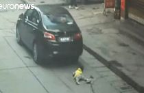 Little girl survives being run over in China