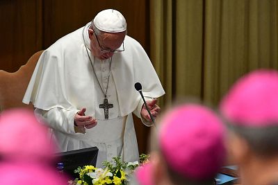 Pope Francis prays during the summit\'s opening on Thursday.