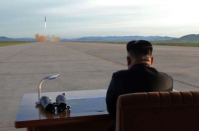 North Korean leader Kim Jong-Un inspecting a launching drill of the medium-and-long range strategic ballistic rocket Hwasong-12.