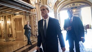 Image: Robert Mueller departs after a closed-door meeting