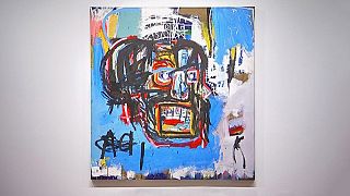 Sold! Basquiat 'skull' canvas goes for 84 million euros at 'electrifying' auction
