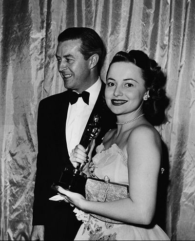 Havilland wore a sleeveless gown to accept the trophy for her 1947 performance. 