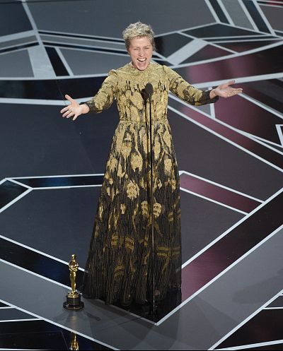 Frances McDormand radiated joy in this gold-and-black number.