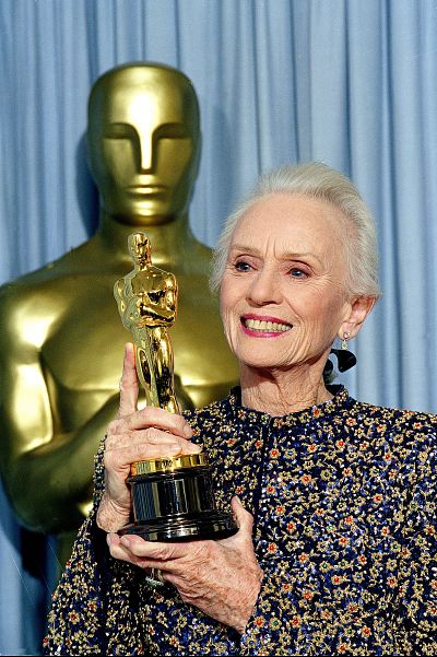 Actress Jessica Tandy holds up the Oscar she won for her role in "Driving Miss Daisy," at the 62nd Annual Academy Awards in Los Angeles, March 26, 1990.  (AP Photo/Doug Pizac)