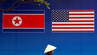 Image: A banner showing North Korean and U.S. flags ahead of the this weeks