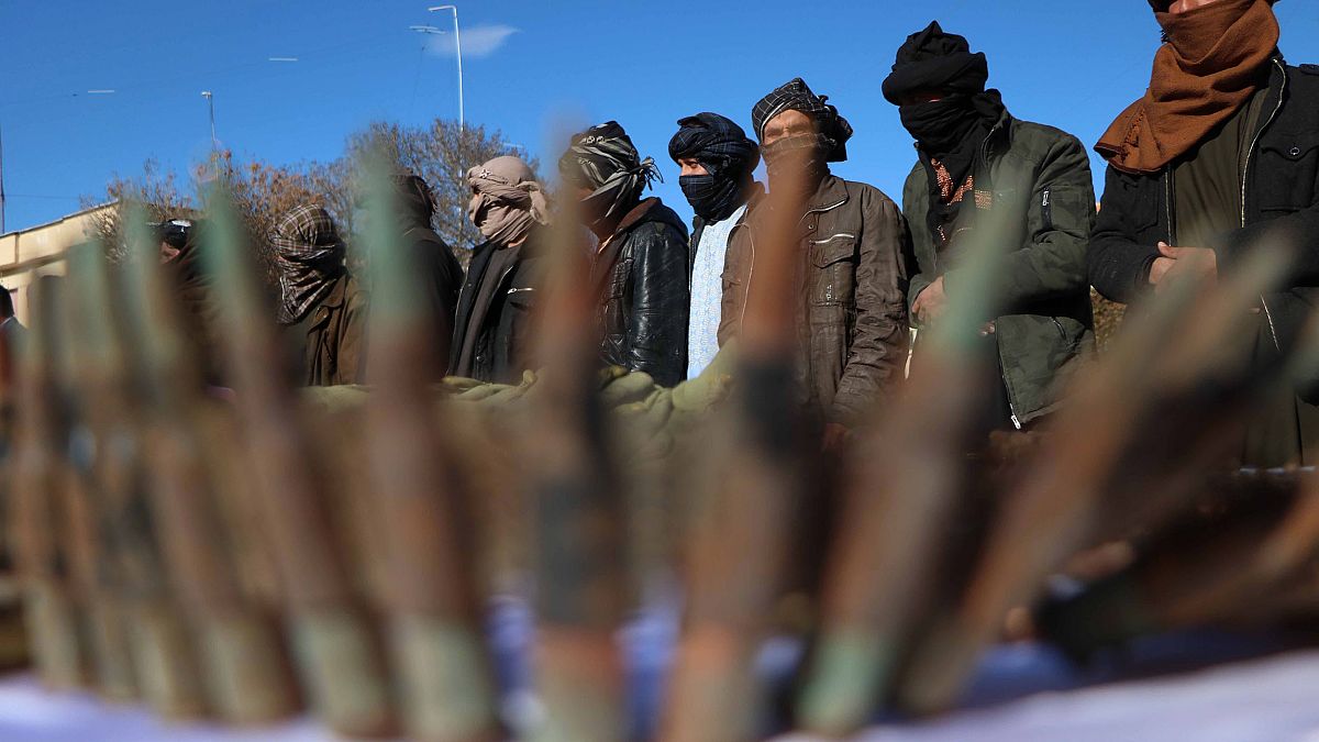 Image: Militants surrender as part of reconciliation initiative