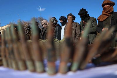 Former Taliban militants surrender their weapons during a reconciliation ceremony in Herat, Afghanistan, on Feb. 6.