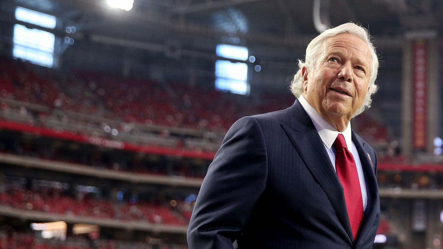 Image: Robert Kraft, owner of the New England Patriots, walks on the field 