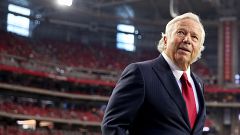 Image: Robert Kraft, owner of the New England Patriots, walks on the field 