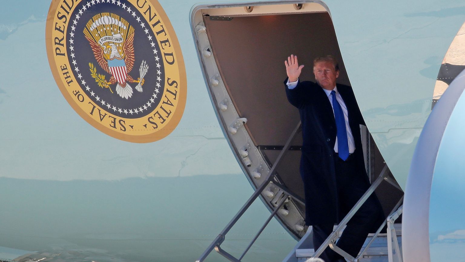 Image: U.S. President Donald Trump boards Air Force One as he departs Joint