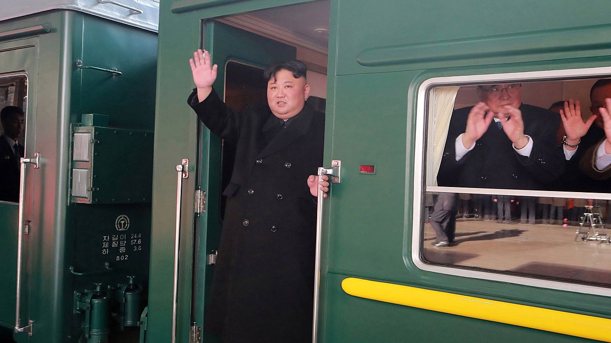 Image: Kim Jong Un waves from his train before leaving Pyongyang on his way