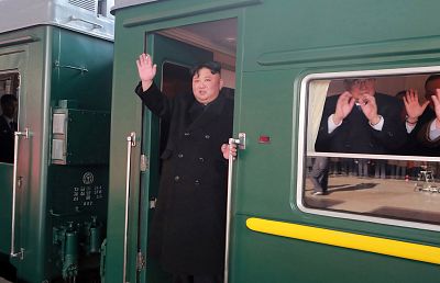 Kim Jong Un waves from his train before leaving Pyongyang on his way to Vietnam.