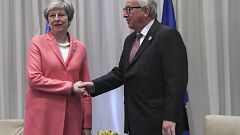 Image: British Prime Minister Theresa May shakes hands with European Commis