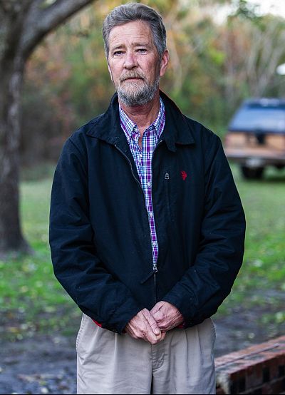 Leslie McCrae Dowless poses for a portrait outside of his home in Bladenboro, North Carolina on Dec. 5, 2018.