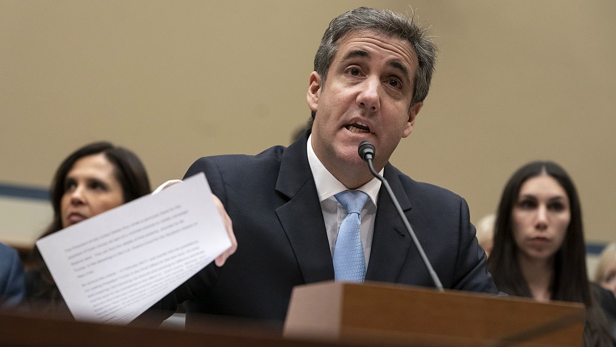 Image: Michael Cohen, former lawyer for President Donald Trump, reads his o