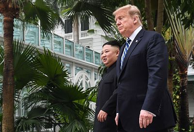 President Donald Trump walks with North Korea\'s leader Kim Jong Un during a break in talks in Hanoi, Vietnam, on Thursday.