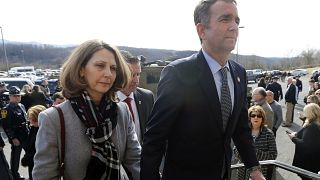 Image: Virginia Gov. Ralph Northam and his wife Pam leave the funeral of fa